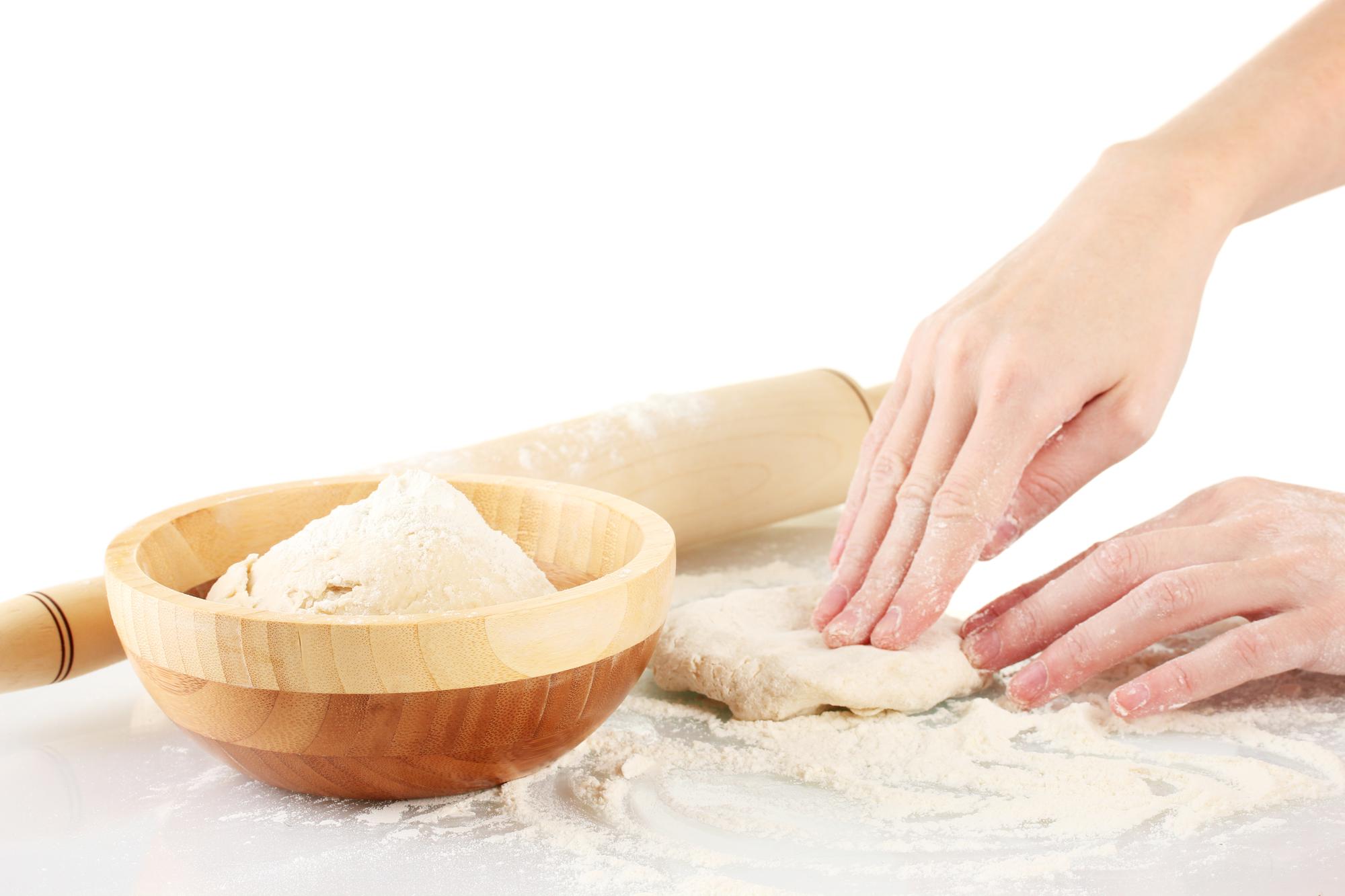 Student preparing dough in class